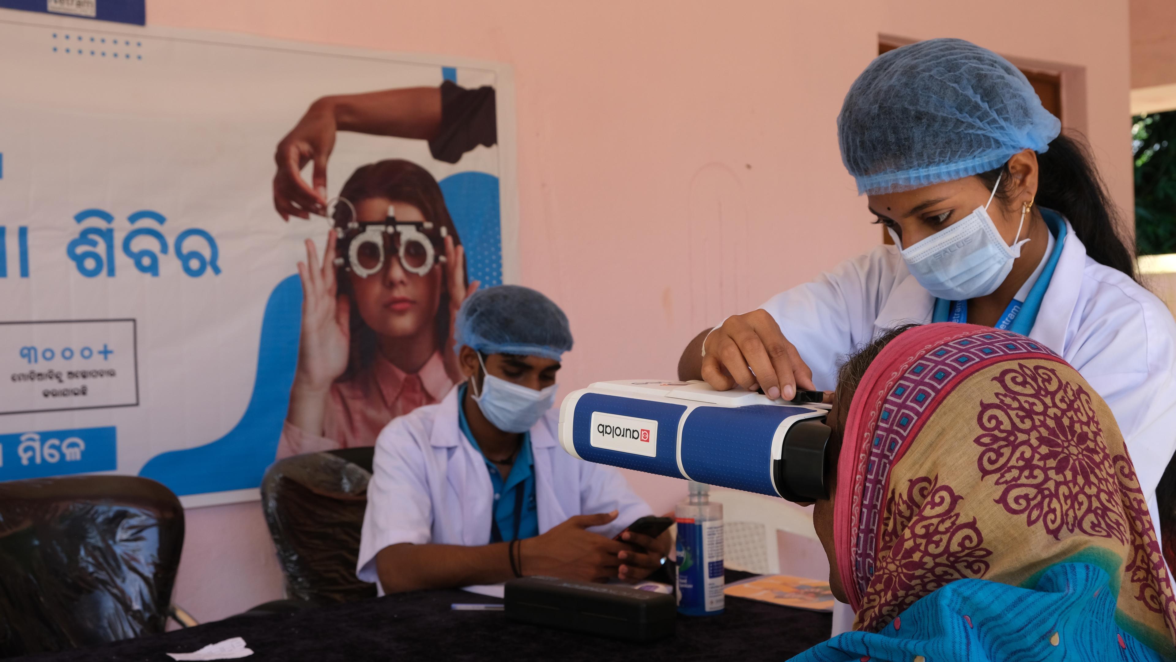 A CareNetram employee during an eye examination